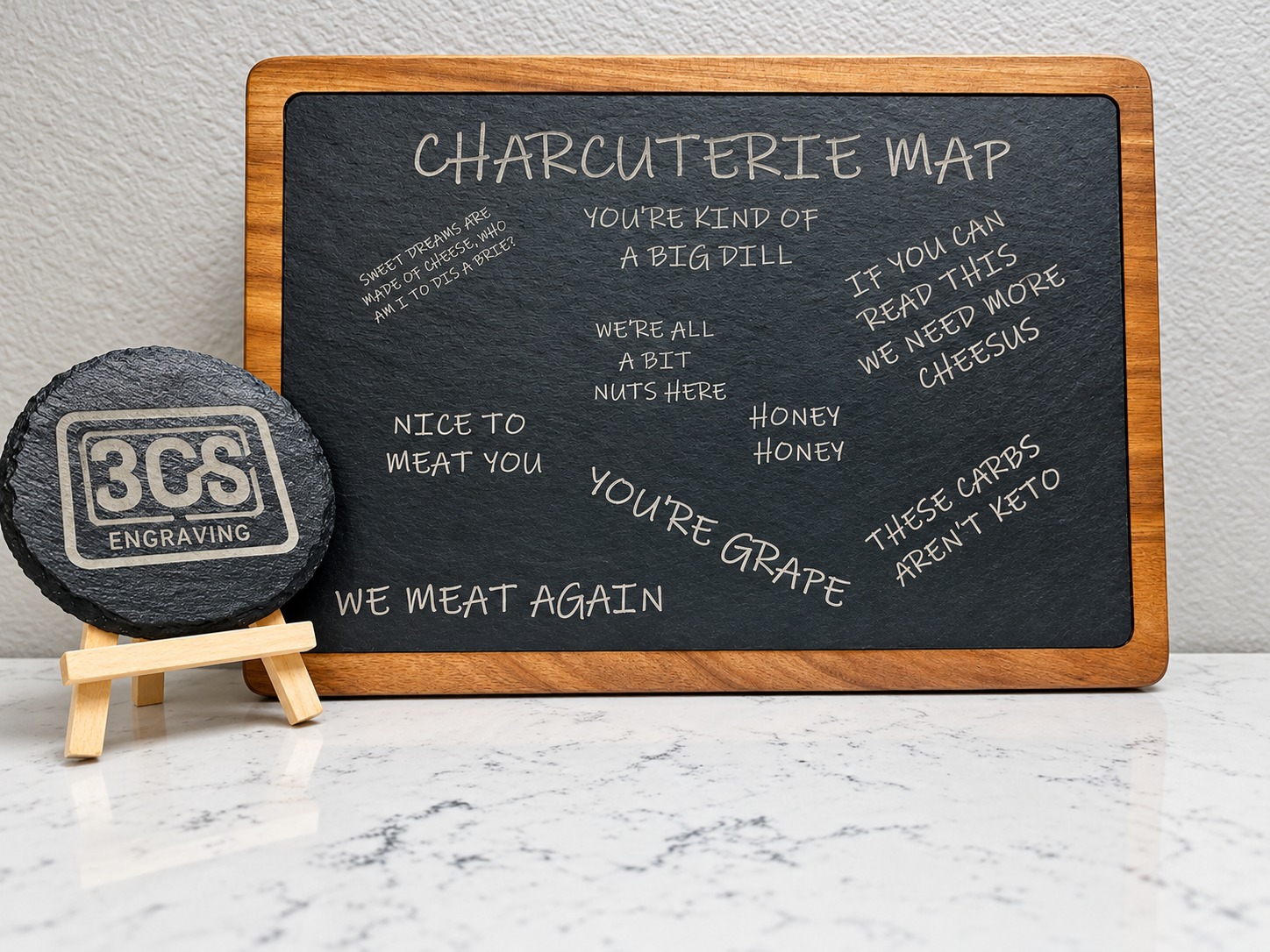Engraved charcuterie map serving board with playful food sayings