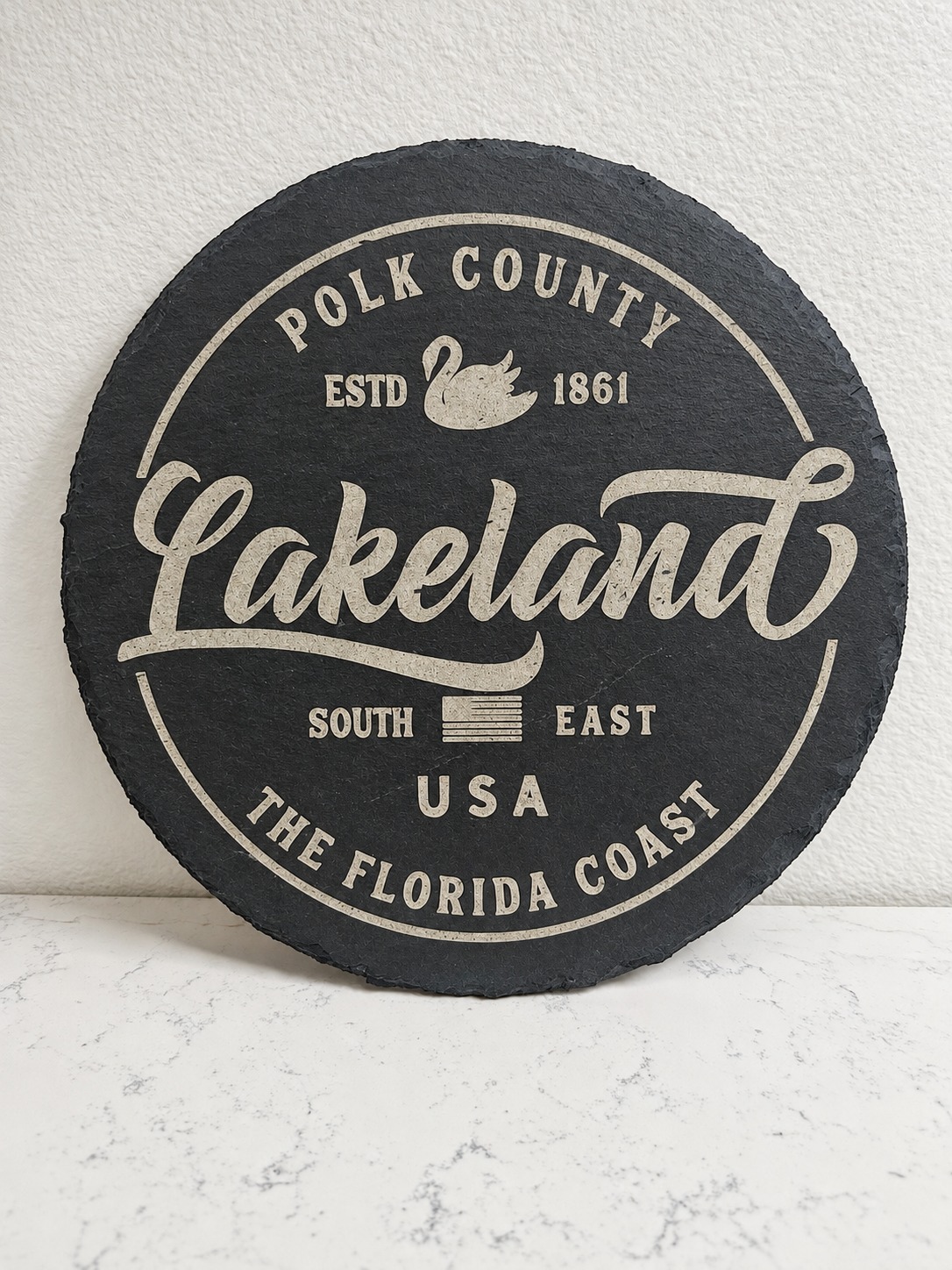 Round engraved slate board with Lakeland Florida artwork