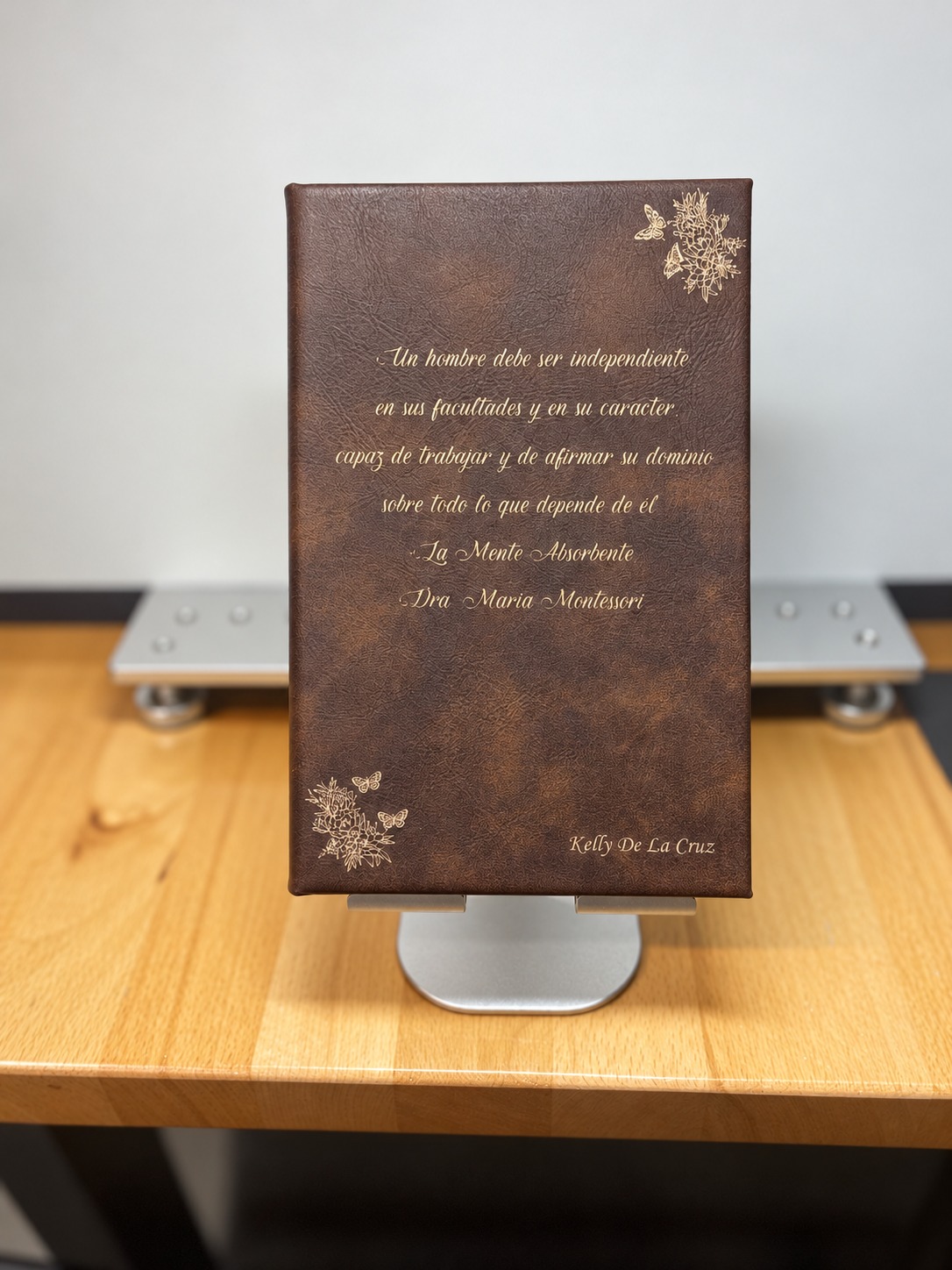 Brown leatherette journal personalized with a Spanish quotation, floral accents and name
