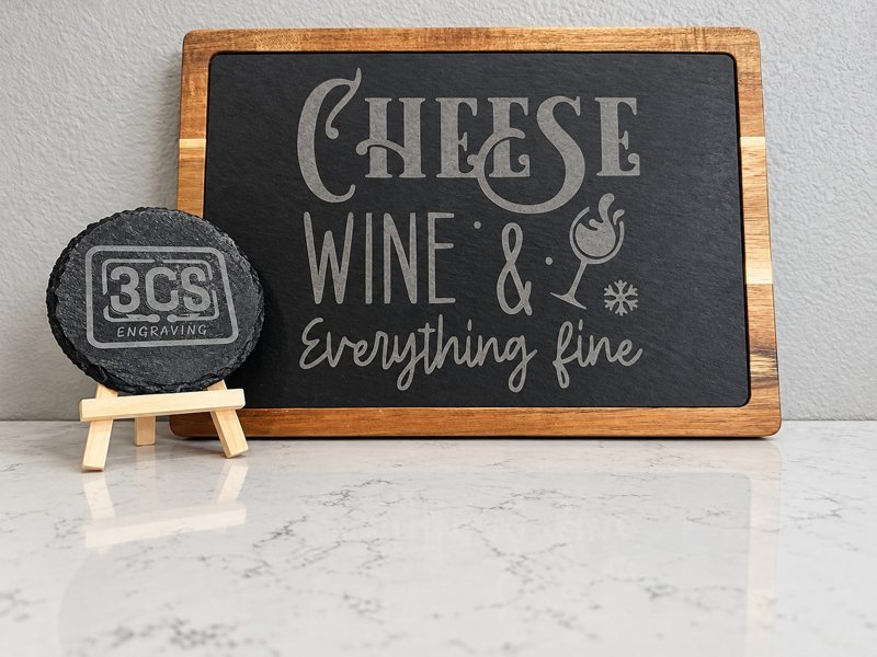 Engraved wood and slate cheese board with matching logo coaster