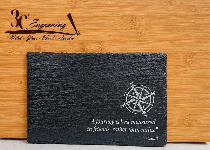 Engraved slate serving board with compass and friendship quote