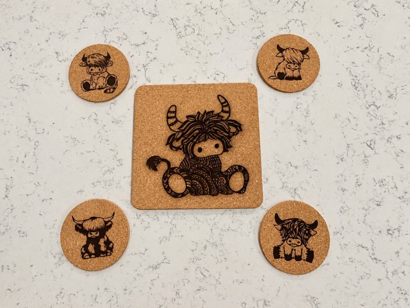 Engraved Highland cow cork trivet with four round cork coasters