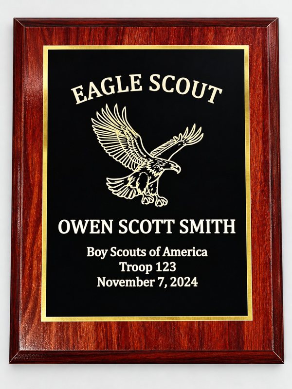 Custom engraved Eagle Scout award plaque with a wood frame, black face, and gold border