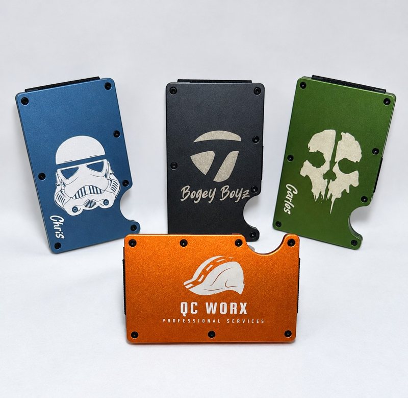 Four custom engraved metal wallets in blue, gray, green and orange
