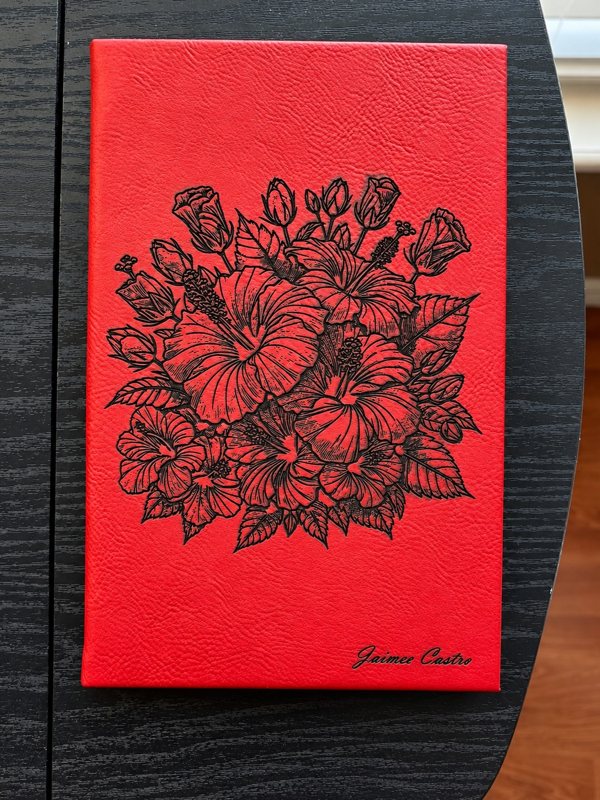 Red leatherette journal with custom hibiscus floral engraving and personalized name