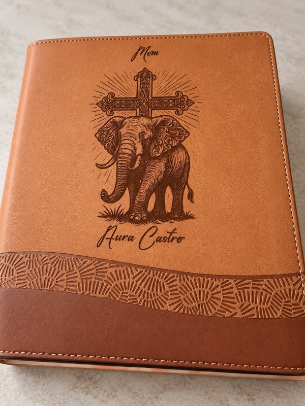 Brown Bible engraved Mom, Aura Castro, with elephant and ornate cross artwork