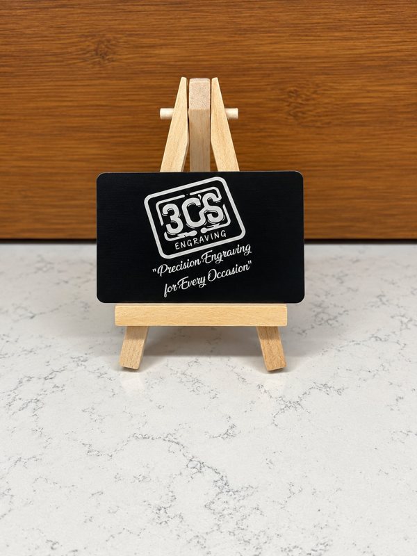Premium black aluminum business card with silver 3Cs Engraving logo and custom engraving